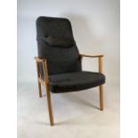 A mid century light oak upholstered arm chair. W:63cm x D:65cm x H:105cm