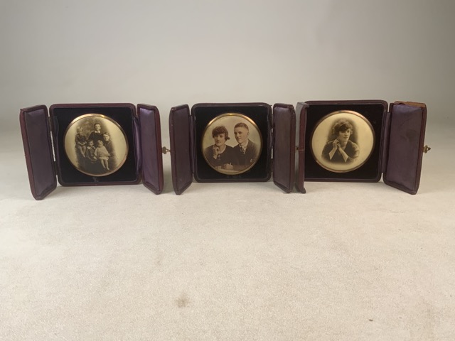 Three circular Victorian photographs in leather cases. W:10cm.