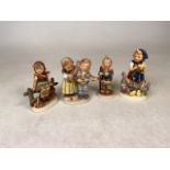 Four Hummel figurines. Little Red Rising Hood stamped 1936. Tallest:12cm