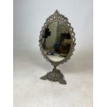 A brass swing dressing table mirror. H:50cm.