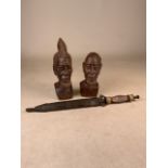 Two African wood-carving bust and knife with sheath. Knife and sheath: 34cm. Bust: H:20cm. Bust: