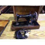 A boxed electric Singer sewing machine - serial number Y8182246