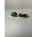 Two unmarked yellow metal gents dress rings set with green cabochon jade and turquoise st