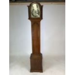 An oak cased grandmother clock. Silvered face with silvered chapter ring. Camerer Cuss and Co 54/6