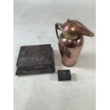 Three Arts and Crafts items to include a lidded copper and brass jug, a copper lidded box and a