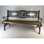 A childs bench, painted metal back and sides with farmyard details. Wooden slats. W:94cm x D: