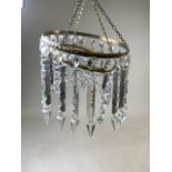 A gilt metal double drop lustre chandelier.