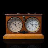A Jaques & Son Congress Chess Timer with twin dials having seconds dials, a going/stop