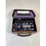 A travelling dressing set with mirror and brush in a leather case. W:24cm x D:17cm x H:7cm