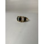 A 14k gold Opal and onyx dress ring. 2.5 g size T.