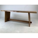 An arts and crafts style oak bench.W:118cm x D:36cm x H:40cm