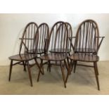 A set of six Ercol mid century stick back chairs. W:62cm x D:41cm x H:96cm