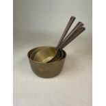 Six French brass saucepans of varying sizes