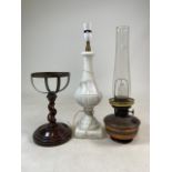 A solid marble table lamp, a copper oil lamp with chimney also with a turned mahogany stand.Marble