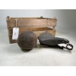 A vintage Dunlop bike saddle also with a pre war leather lace up football and a wooden fruit crate.