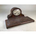 An oak mantle clock also with a carved oak tray.Tray W:50cm x D:22cm.
