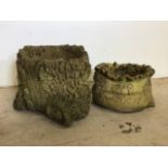 Two concrete planters one in the form of a tree trunk the other a bag of wheat. Largest W:35cm x