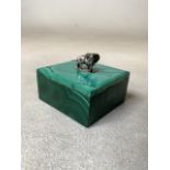 A solid malachite trinket box topped by a silver elephant finial(marked silver)W:5.5cm x D:6cm x