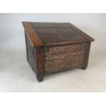 An Arts & Crafts hand beaten copper and oak coal box with metal liner and brass stud finishW:46.