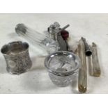 A collection of white metal and glass items.