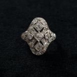 An 18ct gold platinum and diamond Art Deco plaque ring set throughout with old and single cut
