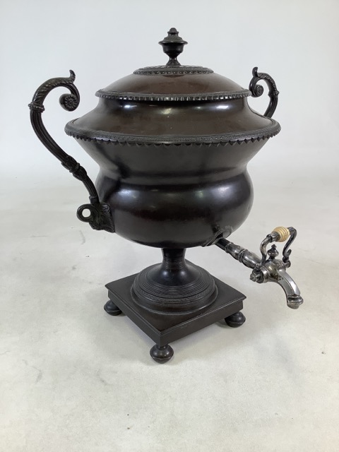 A Regency style Russian bronze Samovar. Silver plated and bone tap to square base raised on squashed