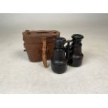 A pair of A Franks binoculars with a leather case