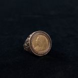 A half sovereign signet ring in a 9ct gold mount. 10.5g Size S