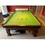 An early 20th century mahogany full sized (12'x 6') slate bed snooker table with all accessories