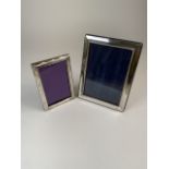 Two sterling silver desk top picture frames. W:16cm x H:21cmW:11cm x H:17cm