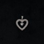 An unmarked platinum and diamond heart pendant set throughout with single cut diamonds to a