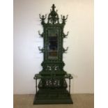 A large Coalbrookedale style hall stand. Green painted heavy metal with various compartments for