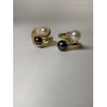 Two 14k gold and cultured pearl crossover rings 7.0g. Size N/P.