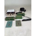 A collection of boxed Singer Sewing machine accessories including lights, manuals and accessories