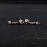 A pair of 19th century platinum and diamond drop earrings. . Each set with single old cut diamond to