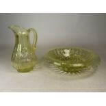 A Uranium yellow glass jug and punch bowl. Jug: H: 31cm. Punch bowl: W:40cm H: 12cm