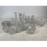 A collection of glassware to include decanters, bonbon dishes, lead crystal bowls and other pieces.