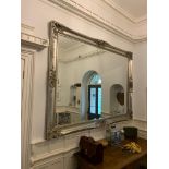 A very large wooden silver gilded over mantle wall mirror. W:245cm x D:9.5cm x H:183cm