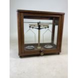 A mahogany cased chemist scales by Thompson Skinner & Hamilton LTD, Glasgow. W:43cm x D:21.5cm x