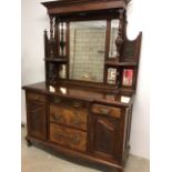 Early 20th century mirrored sideboard with walnut veneer drawers. Three drawers flanked by single