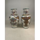 Two Chinese vases decorated with painted birds and garden scenes. H37cm.