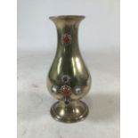 An Arts and Crafts style baluster shaped brass vase with inset glass cabochon decoration. H:26cm