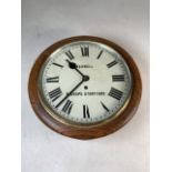 An oak cased raililway style wall clock by Cashwell of Bishops Stortford with chain movement W: