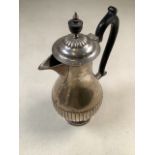A Georgian style coffee pot with half reeded decoration on circular stepped foot by Willian Hutton