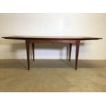 A mid century extending dining table by A Younger. With two pull out leaves.Extended W:212cm x D: