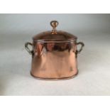 A copper and brass cooking pot.W:19cm x D:12.5cm x H:20cm