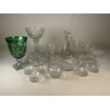 A collection of glassware to include dishes, bon bon dishes, vases, water jug and a green glass