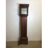 An 18th century oak long case clock with carved detail to front made by John Higgs, Wallingford.