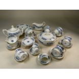 A part dinner service and tea set in Revelry design by Coalport including dinner plates, side