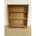 A small mid century glazed bookcase with four sliding glass doors.W:71cm x D:21cm x H:88cm